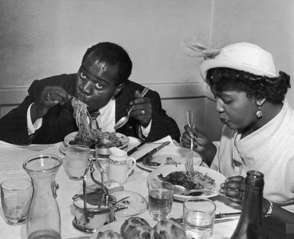 Friends and family sharing fresh pasta